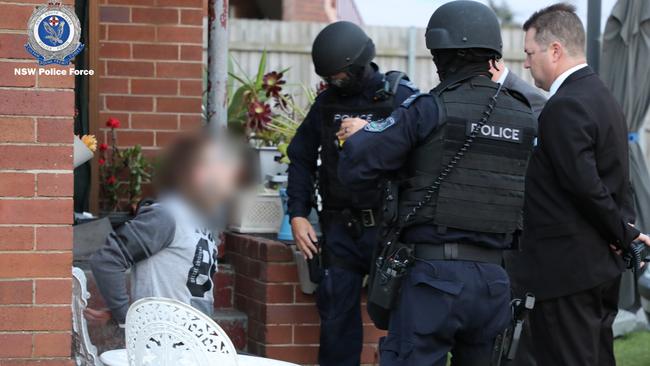 Dalton Trent Oliver shortly after being arrested over the alleged murder of Stockton man Graham Cameron, who was found dead following a unit fire on July 26, 2021. Picture: NSW Police.