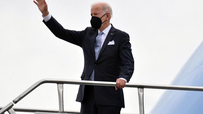 US President Joe Biden has made a fetish out of his black face mask. Picture: AFP