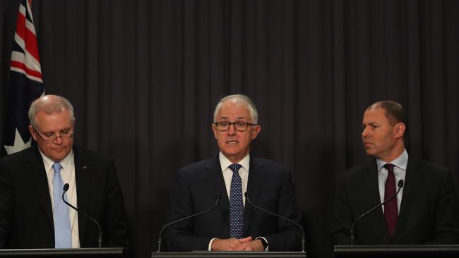 Malcolm Turnbull is flanked by Treasurer Scott Morrison (left) and Energy Minister Josh Frydenberg at this morning’s press conference to announce energy policy changes. Photo: Kym Smith