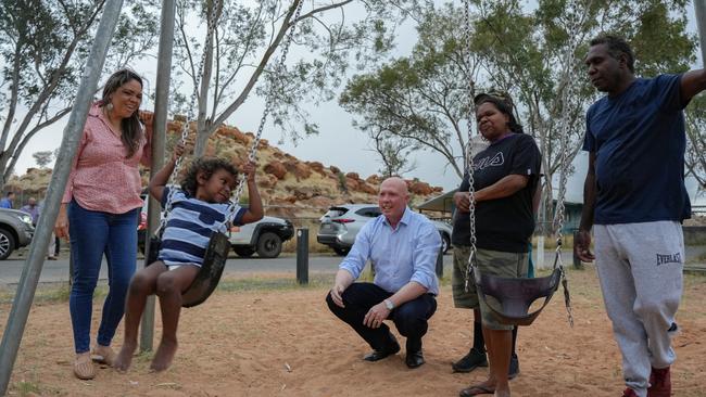 Opposition Leader Peter Dutton in Alice Springs, with Senator Jacinta Price, left, Kerry Pearce, second right, Curtis Haines, right, and their youngest son Damarie.