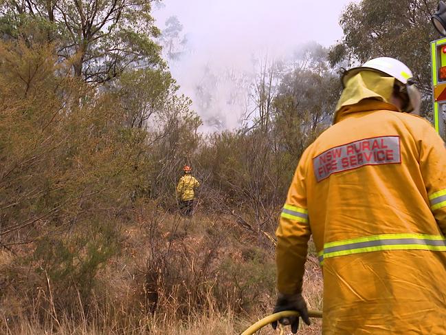 Fire crews work to contain flames at Buxton, NSW, Friday, December 20, 2019. It's feared 40 homes have been lost in the bushfire that tore through Buxton, Balmoral, Bargo and surrounding areas. (AAP Image/Andrew Leeson) NO ARCHIVING