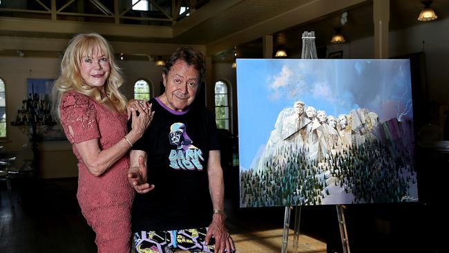 The couple in front of the portrait for Donald Trump. Picture: Jane Dempster/The Australian.