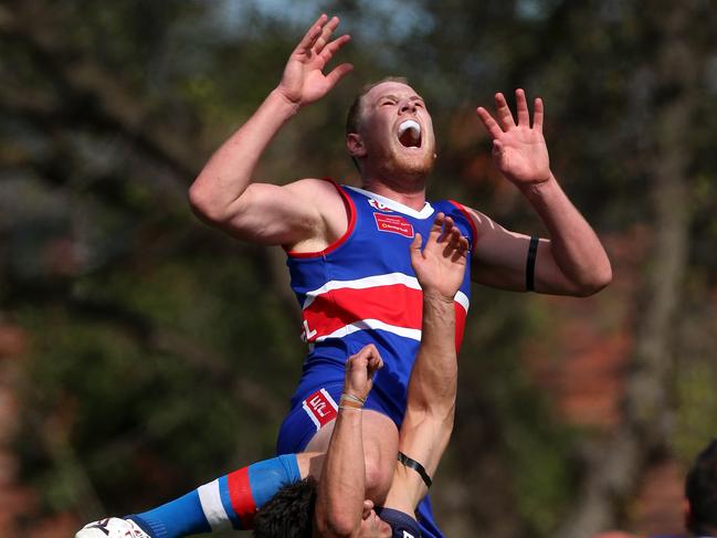 Andrew Browne of Keilor flies for a mark during the EDFL match between Keilor and Strathmore played in Keilor on Firday 25th March, 2016. Picture: Mark Dadswell