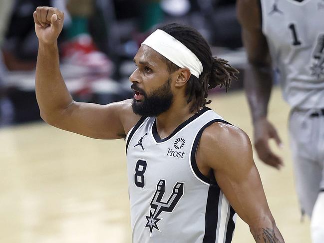 SAN ANTONIO, TEXAS - JANUARY 27: Patty Mills #8 of the San Antonio Spurs reacts after scoring against the Boston Celtics in the second quarter at AT&T Center on January 27, 2021 in San Antonio, Texas. NOTE TO USER: User expressly acknowledges and agrees that, by downloading and or using this photograph, User is consenting to the terms and conditions of the Getty Images License Agreement.   Tom Pennington/Getty Images/AFP == FOR NEWSPAPERS, INTERNET, TELCOS & TELEVISION USE ONLY ==