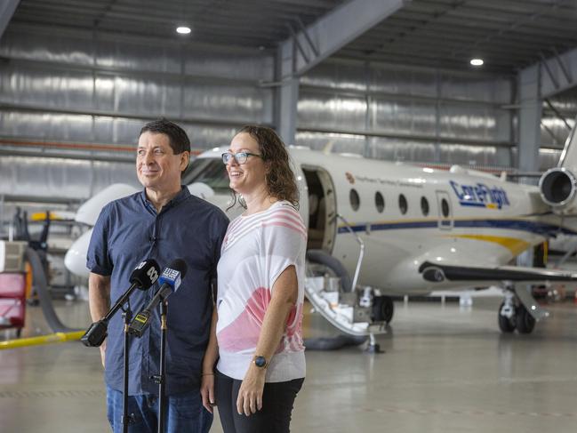 Chris Garner and his wife Ruth speak to the media with CareFlight plane in the background which flew him to an Adelaide hospital in a critical state. Picture: Floss Adams.