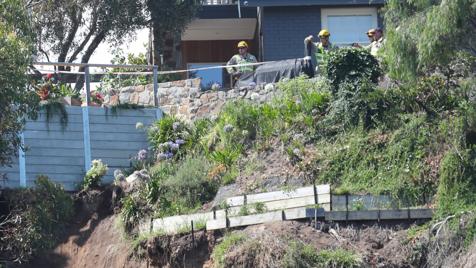 ‘Skin crawling’: Home plunges 50 metres down cliff with man still inside