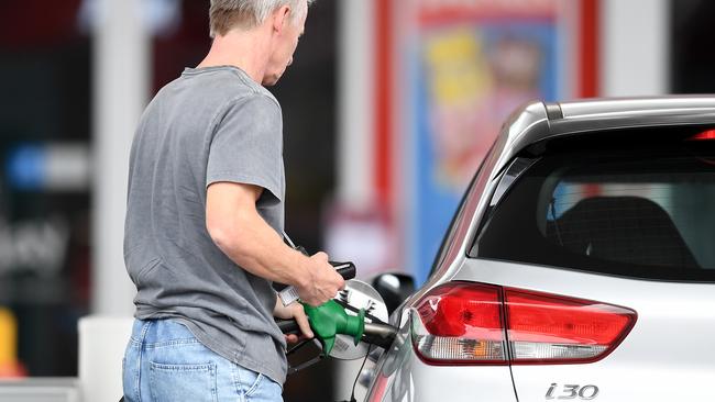 BRISBANE, AUSTRALIA - NewsWire Photos - AUGUST 10, 2021., A man fill up his car at a service station in Woolloongabba, Brisbane. Despite a drop in oil prices unleaded fuel remains high across the country's capital cities at $1.73 a litre in Brisbane, $1.63 in Adelaide, $1.55 in Melbourne and $1.45 in Sydney., Picture: NCA NewsWire / Dan Peled