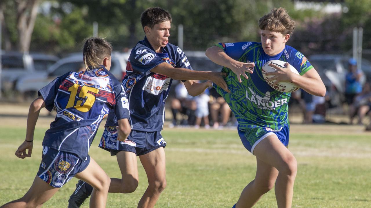 Brigham Siteini and Temanu Taahi for Emus tackle Ashley Cubby for Pacific. Under 15's boys SW Qld Emus vs Pacific Nations Toowoomba. Saturday, February 25, 2023. Picture: Nev Madsen.