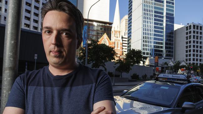 Frequent taxi user Sam Mortimer outside the cab rank on the corner of Ann and Roma street is upset with taxi drivers refusing to use meters for fares in entertainment precincts. Picture Lachie Millard