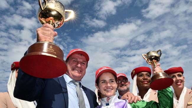 Darren Weir (left) and jockey Michelle Payne celebrate after wining the Melbourne Cup with Prince of Penzance at Flemington. Picture: File