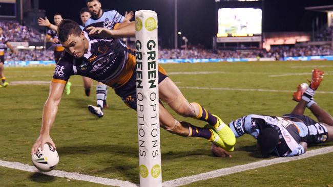 Corey Oates scores a try for the Broncos.