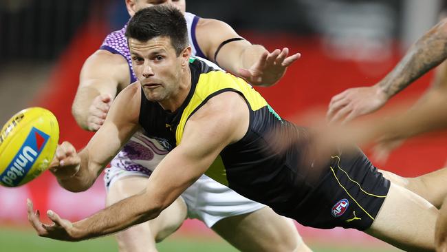 AFL Round 15. Richmond vs Fremantle at Metricon Stadium, Gold Coast.  02/09/2020...  Trent Cotchin of the Tigers clears by hand q1  . Pic: Michael Klein