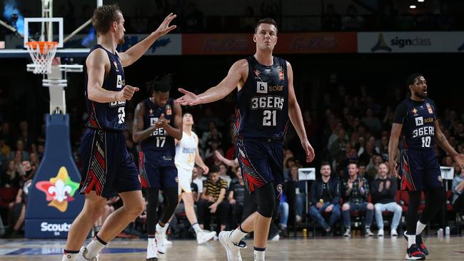 ADELAIDE, AUSTRALIA - OCTOBER 19: Anthony Drmic and Daniel Johnson of the 36ers celebrate while walking to the bench during the round three NBL match between the Adelaide 36ers and the Brisbane Bullets at Adelaide Entertainment Centre on October 19, 2019 in Adelaide, Australia. (Photo by Paul Kane/Getty Images)