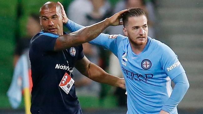 Ross McCormack celebrates a goal with assistant coach Patrick Kisnorbo.