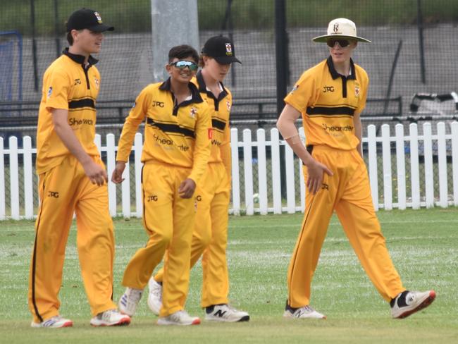 Yug Chaudhari (no hat) celebrates a wicket. Picture: Sean Teuma