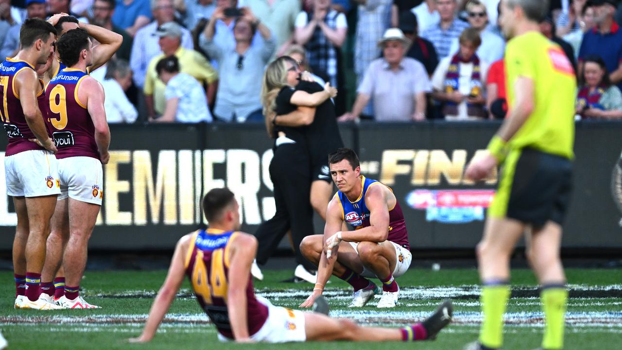 MELBOURNE, AUSTRALIA - SEPTEMBER 30: Brisbane players look dejected after the loss during the 2023 AFL Grand Final match between Collingwood Magpies and Brisbane Lions at Melbourne Cricket Ground, on September 30, 2023, in Melbourne, Australia. (Photo by Quinn Rooney/Getty Images)