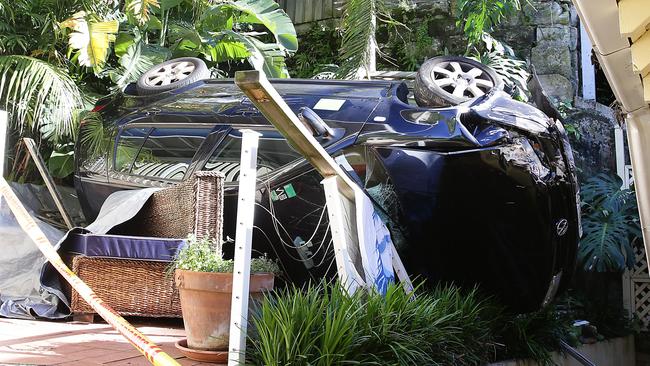 The car that fell into a backyard in Manly, hitting the roof of a house on the way down. Photo Martin Lange