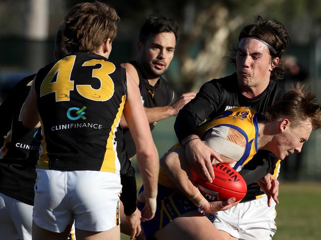 Bailey Lambert is taken in a tackle against Balwyn. Picture: Mark Dadswell