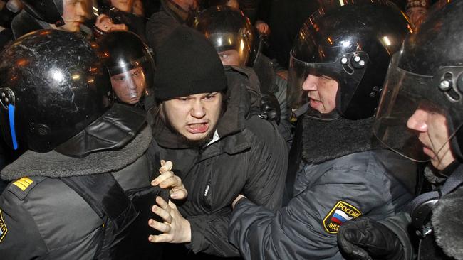 Police detain a demonstrator during protests against alleged vote rigging in Russia's parliamentary elections in Moscow in 2011. Picture: AP