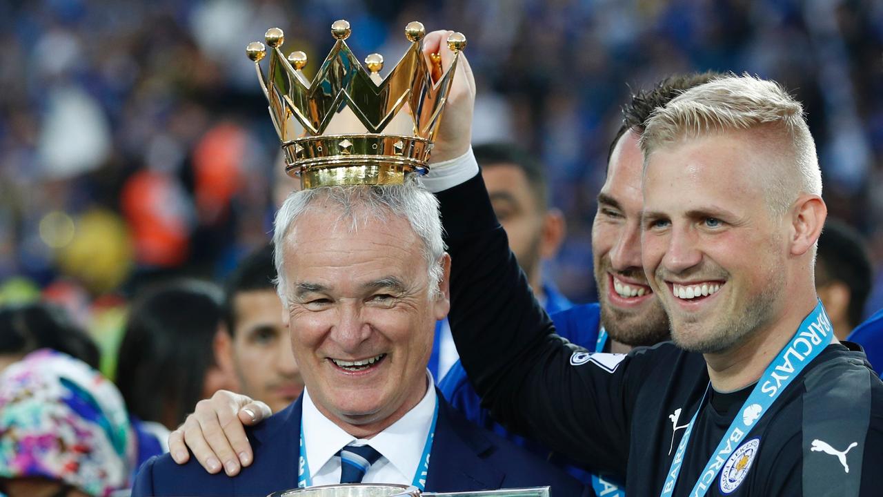 Leicester City's Danish goalkeeper Kasper Schmeichel (R) and Leicester City's Italian former manager Claudio Ranieri (L) after their iconic triumph.