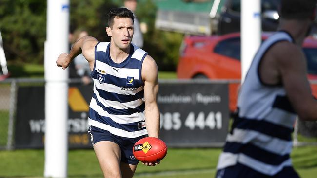 Mathew Dussin handballs. Picture: Andrew Batsch