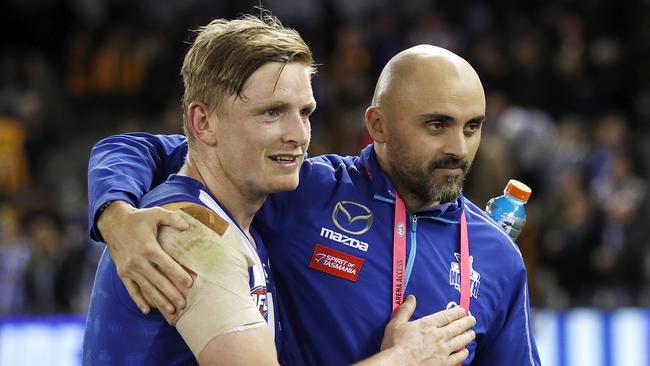 Jack Ziebell and North Melbourne coach Rhyce Shaw celebrate a win.