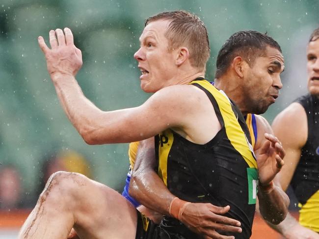 Jack Riewoldt of the Tigers kicks the ball for the winning goal during the Round 22 AFL match between the Richmond Tigers and the West Coast Eagles at the MCG in Melbourne, Sunday, August 18, 2019. (AAP Image/Michael Dodge) NO ARCHIVING, EDITORIAL USE ONLY