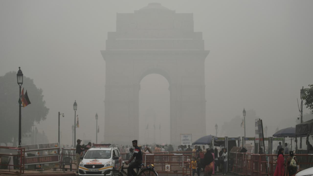 Tourists visit the India Gate under heavy smog condition in New Delhi. Picture: Sajjad Hussain / AFP