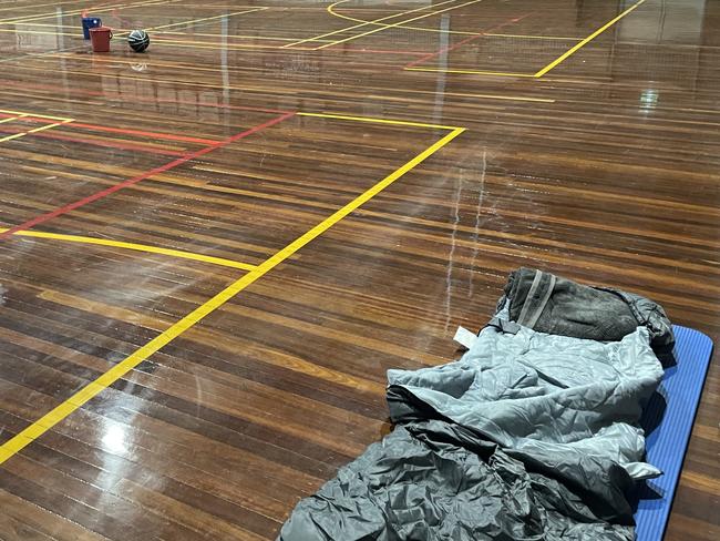 Evacuees slept on the floor of the basketball courts.