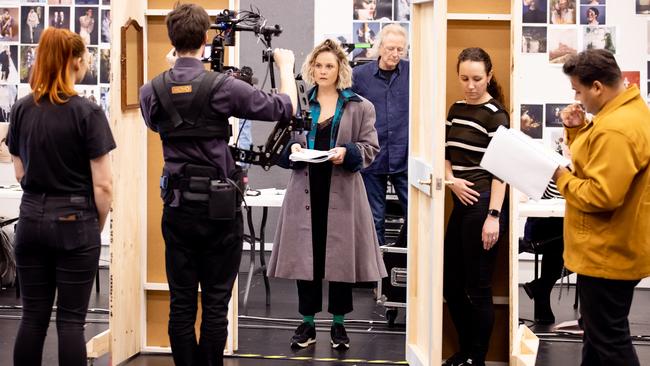 Actor Eryn Jean Norvill, stage manager Jaymi Kniernum (left) and crew in a rehearsal for The Picture of Dorian Gray. Picture: Daniel Boud