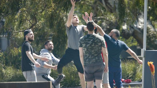 A group of maskless men were seen playing basketball in Epping. Picture: David Caird