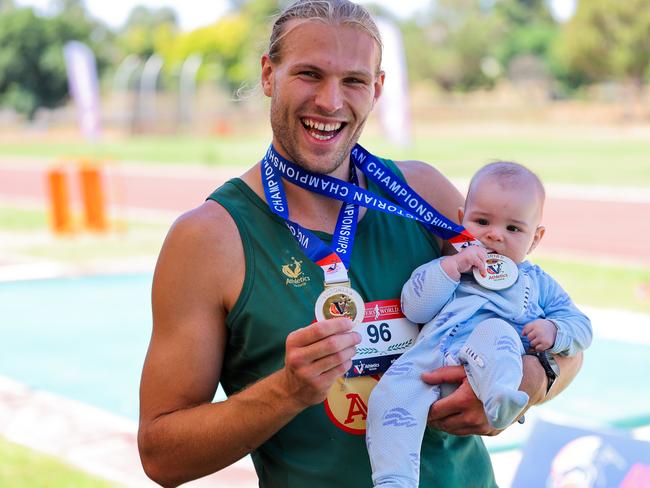 Christian Paynter with son Alexander. Picture: Scott Sidley (SS Athletics)