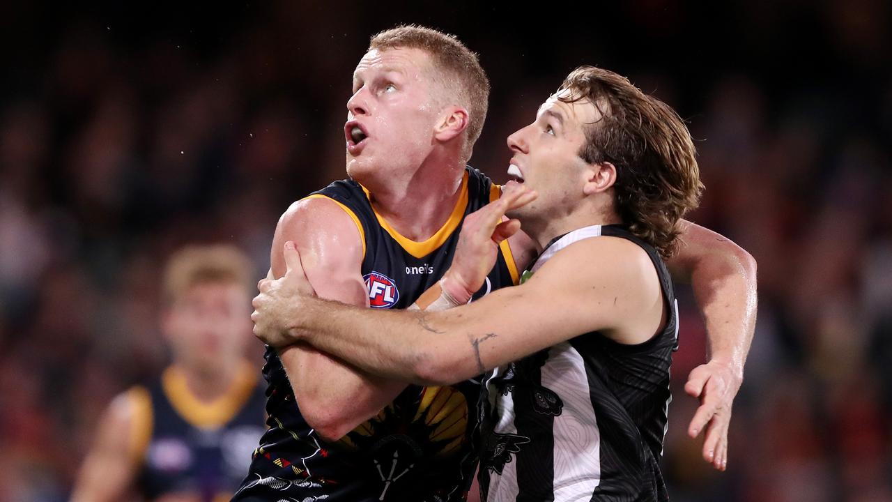 Reilly O'Brien of the Crows and Max Lynch of the Magpies during the 2021 AFL Round 12 match between the Adelaide Crows and the Collingwood Magpies at Adelaide Oval on June 5, 2021 in Adelaide, Australia. (Photo by Sarah Reed/AFL Photos via Getty Images)