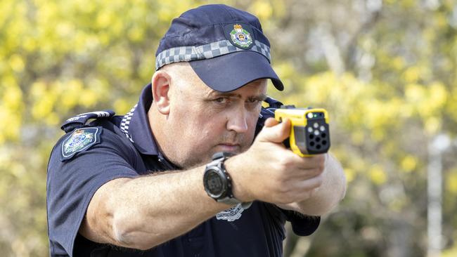 Frontline Skills Instructor Sergeant Mat Chalmers demonstrates use of a Queensland Police Service 'Taser 10' at Oxley Police Academy (FILE PHOTO). Picture: Richard Walker.