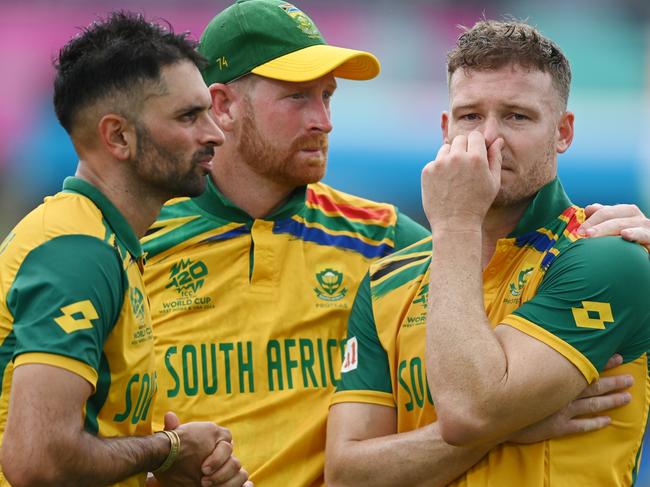 BRIDGETOWN, BARBADOS - JUNE 29: Heinrich Klaasen, Keshav Maharaj and David Miller of South Africa cut dejected figures following the ICC Men's T20 Cricket World Cup West Indies & USA 2024 Final match between South Africa and India at Kensington Oval on June 29, 2024 in Bridgetown, Barbados. (Photo by Gareth Copley/Getty Images)