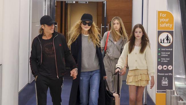 The couple had their two daughters, Sunday Rose and Faith Margaret, with them at Sydney Airport. Picture: Chris Dyson/BACKGRID