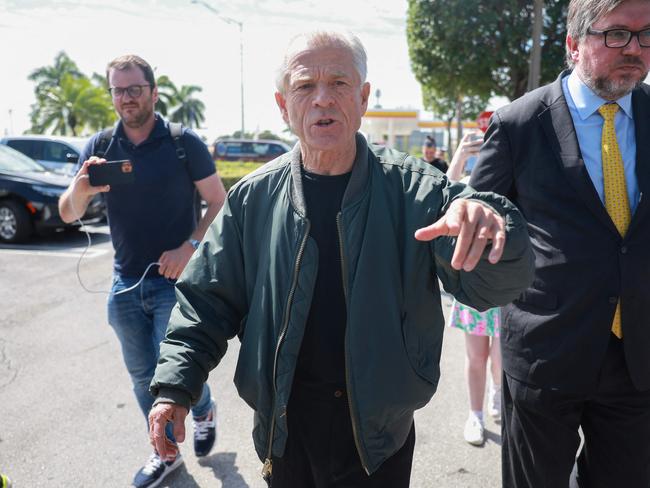 MIAMI, FLORIDA - MARCH 19: Former Donald Trump adviser Peter Navarro walks away after holding a press conference before turning himself into a federal prison on March 19, 2024, in Miami, Florida. Mr. Navarro, who was convicted of contempt of Congress last year, surrendered at a federal Bureau of Prisons facility to begin serving his four-month sentence after speaking to the media.   Joe Raedle/Getty Images/AFP (Photo by JOE RAEDLE / GETTY IMAGES NORTH AMERICA / Getty Images via AFP)