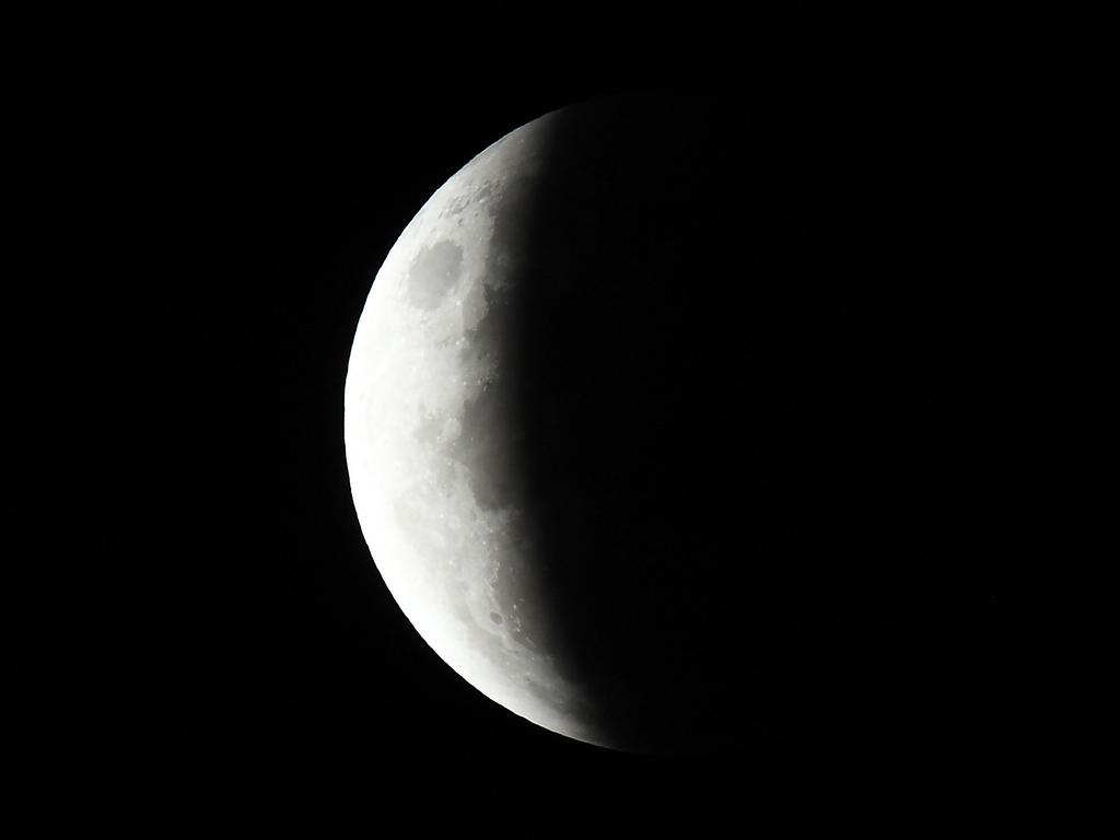 The full moon is seen during the partial eclipse in Sydney. Picture: AFP