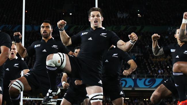 TO GO WITH AFP STORY BY CHRIS FOLEY (FILES) In a file picture taken on October 16, 2011 New Zealand's players including captain Richie McCaw (C), center Ma'a Nonu (R) and hooker Keven Mealamu (2L), perform the haka before the 2011 Rugby World Cup semi-final match Australia vs New Zealand at Eden Park Stadium in Auckland. New Zealand's pre-match haka may be one of sports most famous rituals and often claimed to intimidate opposing sides, but now its benefits to the All Blacks are being questioned. AFP PHOTO / PHIL WALTER / POOL