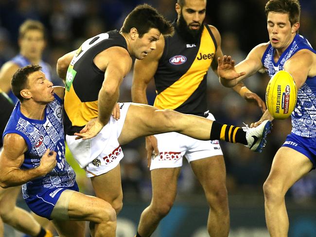 Trent Cotchin wins a clearance against the Kangaroos. Picture: Wayne Ludbey