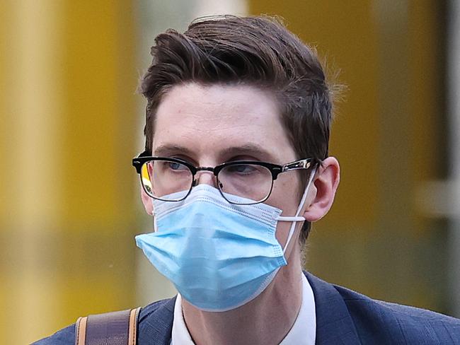 SYDNEY, AUSTRALIA - NewsWire Photos OCTOBER 21, 2020. Pictured is former NSW Crown Solicitor's Office Cory David Sloan Millar-Powell(blue suit /skinny blue tie) an aspiring lawyer previously employed by the NSW Crown Solicitor' Office  in Sydney. He is pictured on his way to  Downing Centre Court. Picture: NCA NewsWire / Dylan Coker