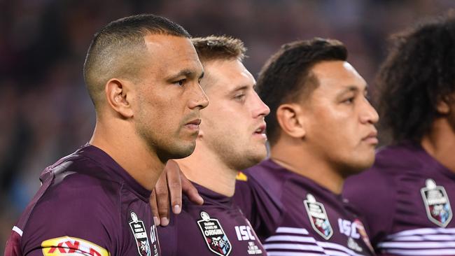 Will Chambers, Cameron Munster and Josh Papalii link arms during the national anthem last year. Picture: AAP Image/Dave Hunt