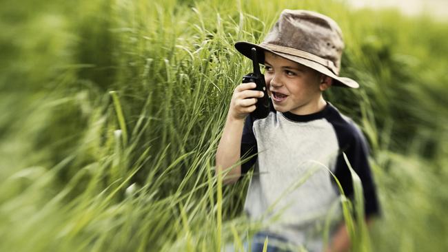 Young boy with walkie-talkie. iStock.