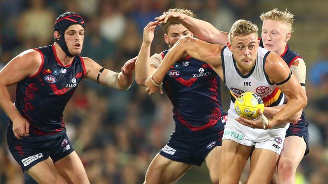 Hugh Greenwood breaks away from Demons Clayton Oliver, Jack Viney and Angus Brayshaw. Picture: Scott Barbour/Getty