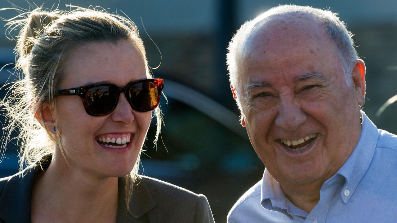 In this file photo taken in 2016, the founder and chairman of the Inditex fashion group Amancio Ortega laughs with his daughter Marta. Picture: Miguel Riopa/AFP