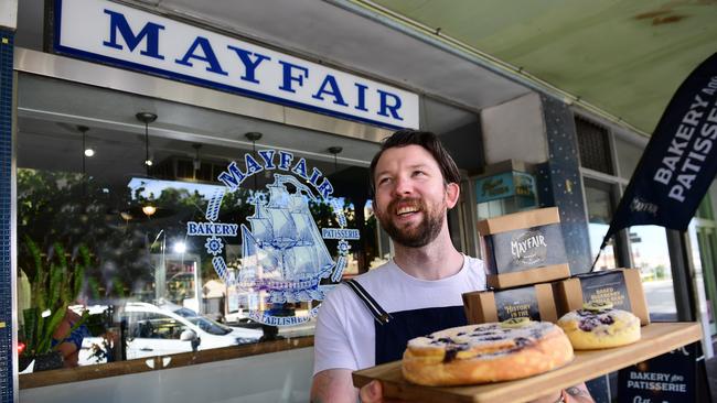 Phil Donnelly celebrates Mayfair Bakery's 150th anniversary with his gluten free baked blueberry vanilla bean cheesecake he's hoping to get into supermarkets. Picture: Mark Brake