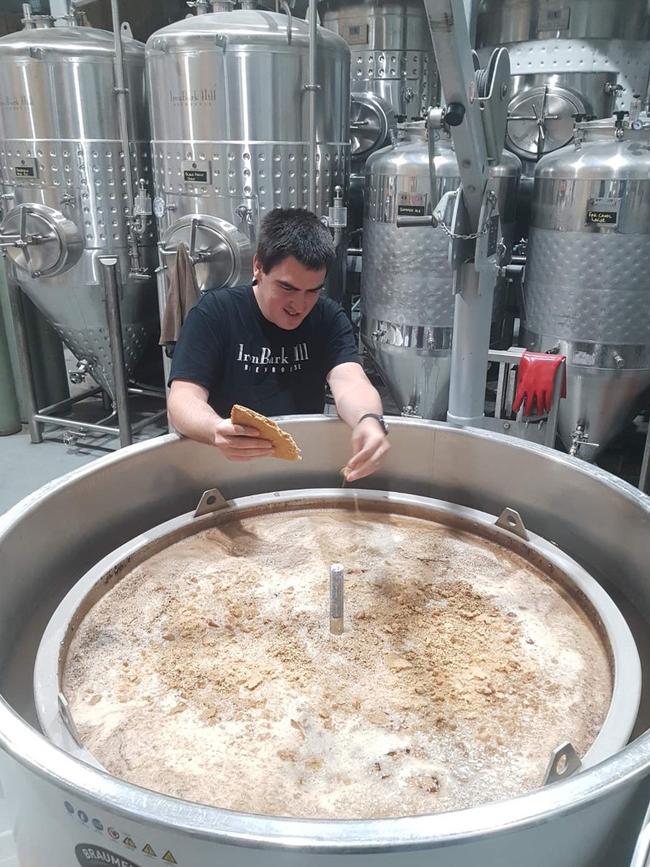 Iron Bark Hill’s head brewer Andrew Drayton mixes in the graham crackers to the brew.