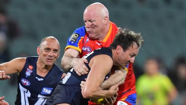 Andrew Jarman tackles Jude Bolton in last year’s Legends game. Picture: AAP