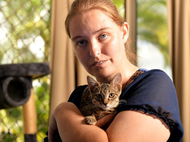 Emma Gregory organised a protest outside Townsville City Council in a bid to force the council to reverse its decision regarding the RSPCA leaving Townsville. Emma is pictured with RSPCA rescue cat, Beans.