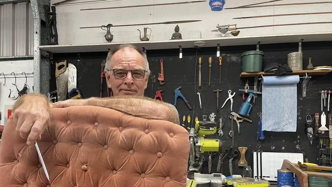 Cairns craftsman Rob McNamara has been in the upholstery business since 1974 and said he's noticed more people wanting furniture restored instead of going into landfill. Picture: Alison Paterson